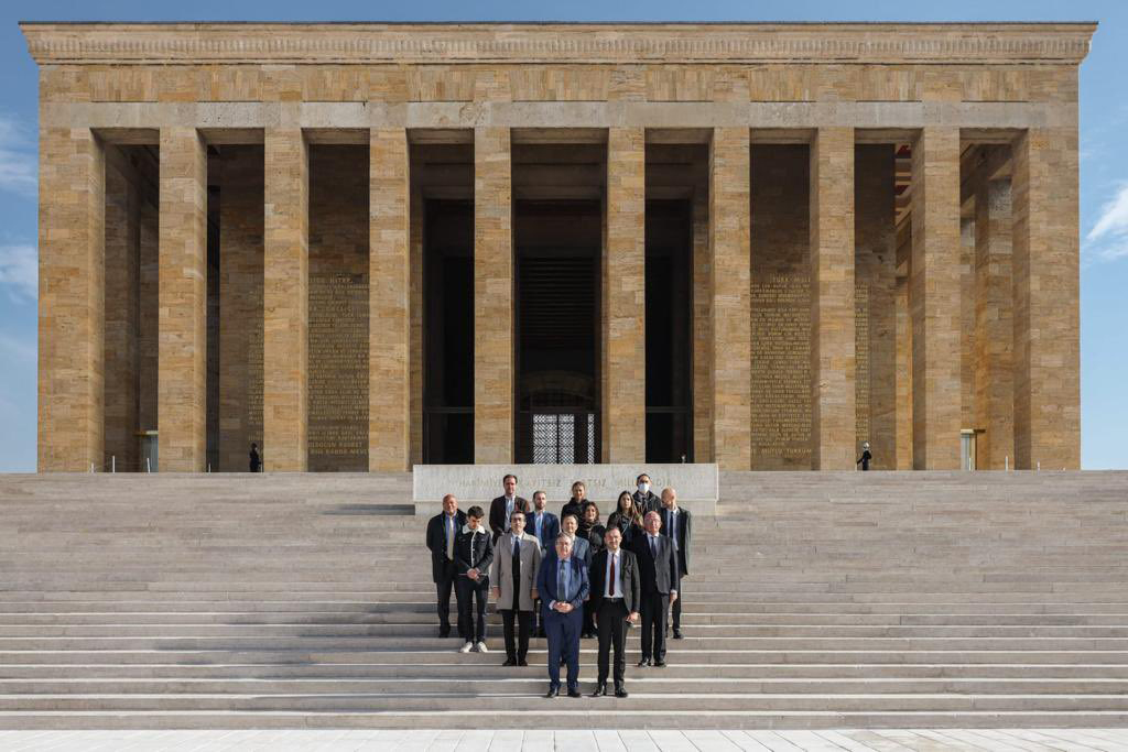 The delegation poses in front of the Mausoleum