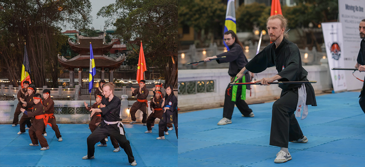 Martial arts practitioners demonstrating their skills on a mat outdoors